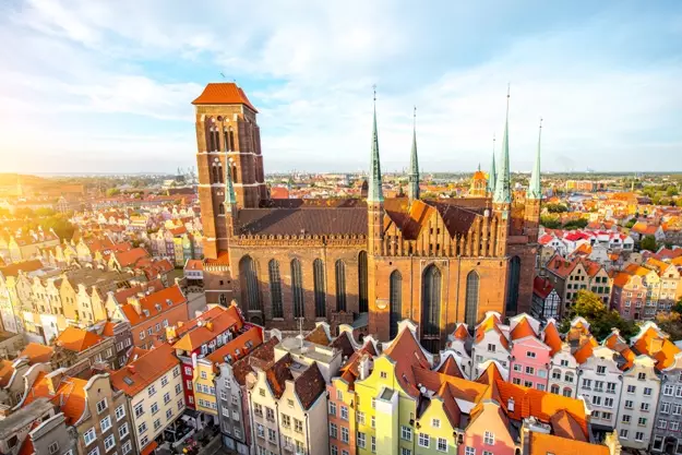 Cityscape aerial view on the old town with saint Marys church on the sunset in Gdansk Poland